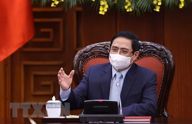 政府总理范明政：越南疫情防控工作取得积极成果 ảnh 1