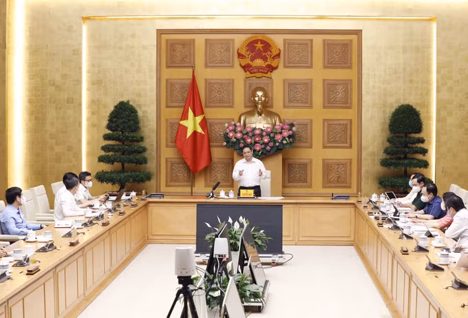 政府总理范明政：尽早研发出国产新冠疫苗势在必行 ảnh 1