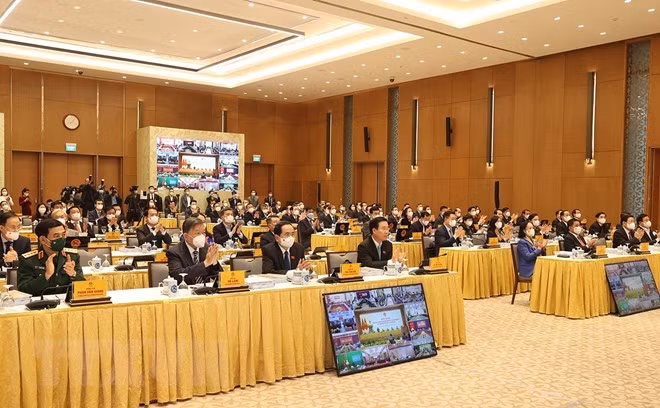 越南成为新冠疫苗接种率最高的6个国家之一 ảnh 2
