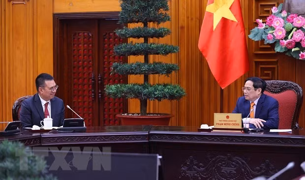 政府总理范明政会见在越投资的泰国两家公司领导 ảnh 1